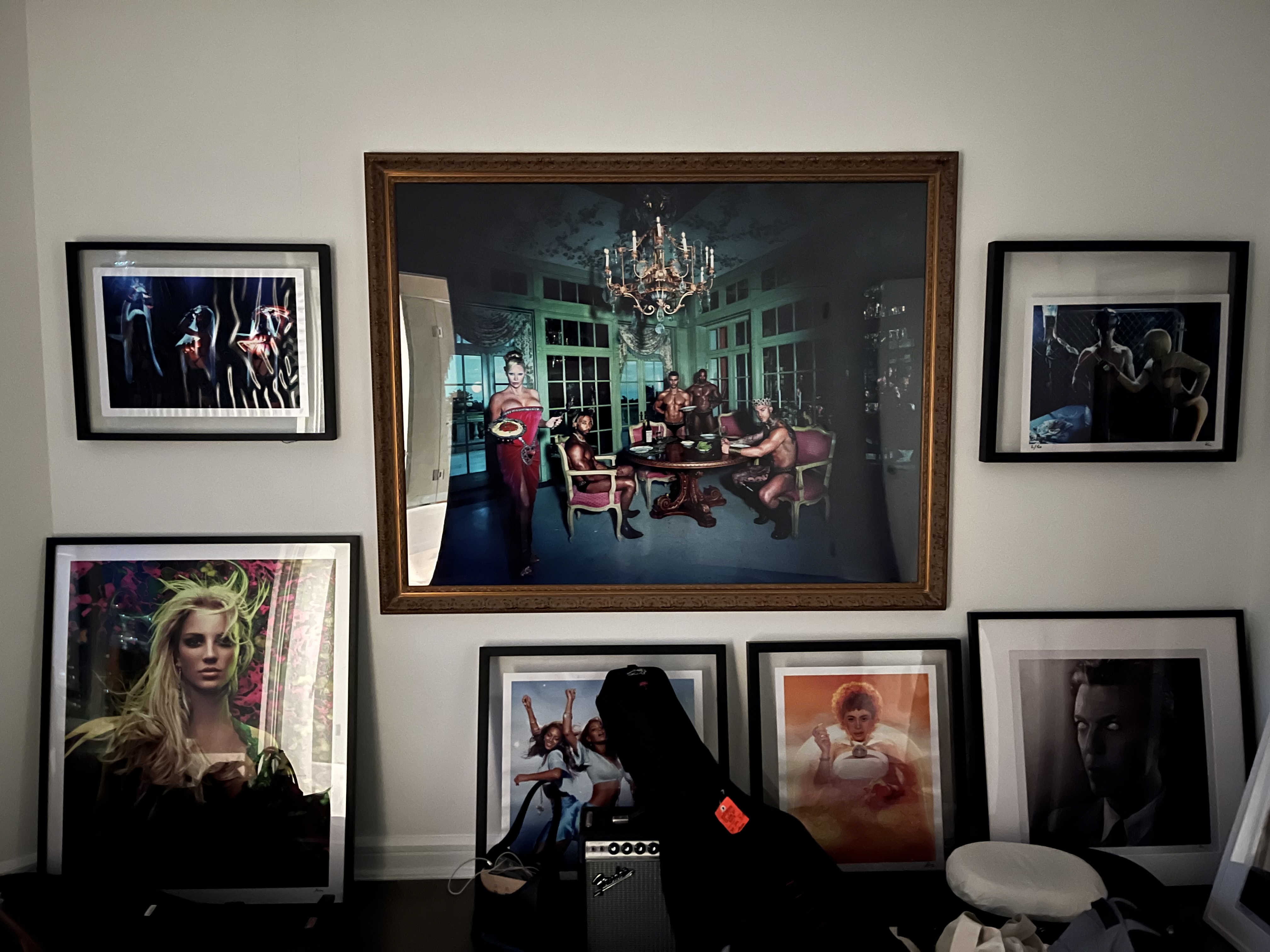 Wall of framed art prints and photography
